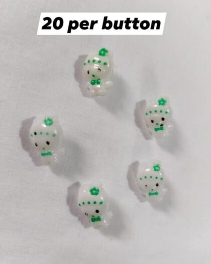 Close-up of Azadi Mini Dolls Buttons in green and white – HnA Boutique Pakistan