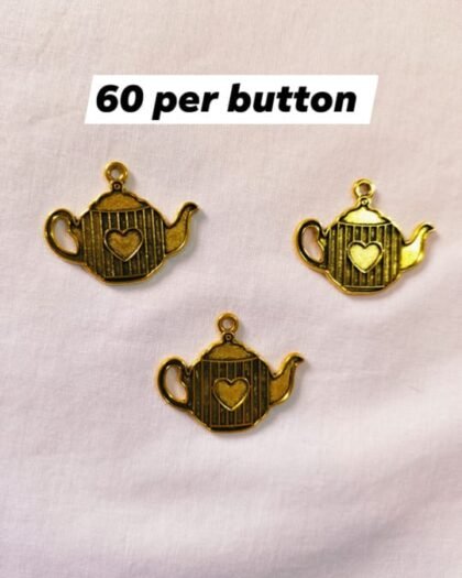 Close-up of Metal Kettle Buttons with vintage kettle design – HnA Boutique Pakistan