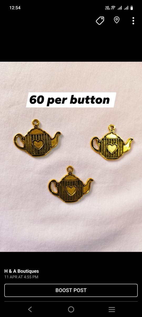 Close-up of Metal Kettle Buttons with vintage kettle design – HnA Boutique Pakistan