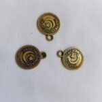 Close-up of Metal Pakistani Coin Buttons – vintage-style fashion buttons at HnA Boutique Pakistan