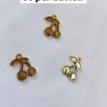 Close-up of Metal Cherry Buttons with glossy metallic finish – HnA Boutique Pakistan