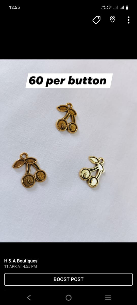 Close-up of Metal Cherry Buttons with glossy metallic finish – HnA Boutique Pakistan