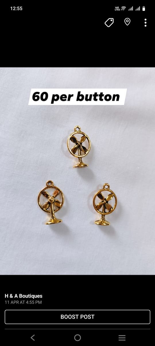 Close-up of Metal Fan Buttons with detailed fan design – HnA Boutique Pakistan
