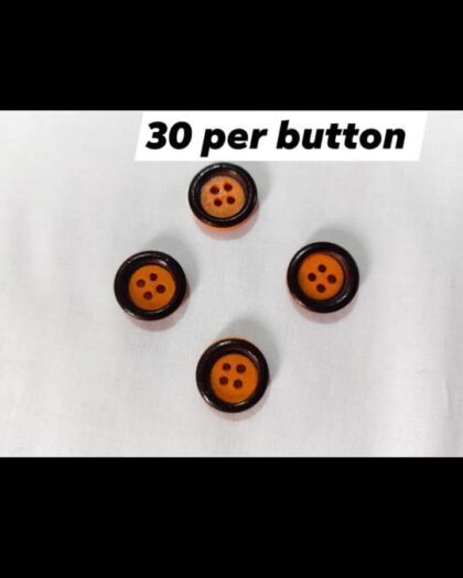 Orange & Black funky buttons close-up showing bold color combo – HnA Boutique Pakistan