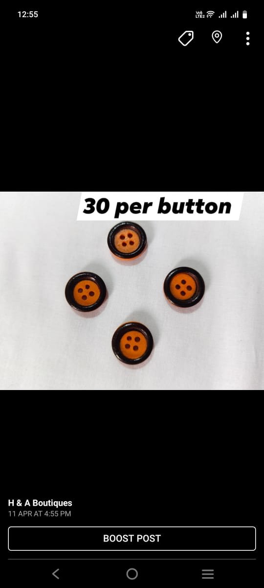 Orange & Black funky buttons close-up showing bold color combo – HnA Boutique Pakistan