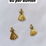 Close-up of Metal Princess Dress Buttons with metallic finish – HnA Boutique Pakistan