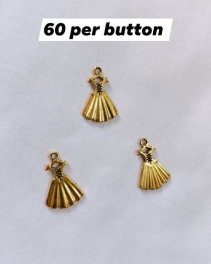 Close-up of Metal Princess Dress Buttons with metallic finish – HnA Boutique Pakistan