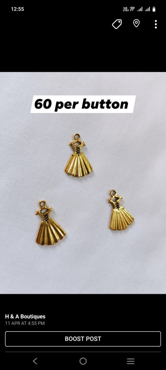 Close-up of Metal Princess Dress Buttons with metallic finish – HnA Boutique Pakistan