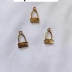 Close-up of Metal Purse Buttons showing purse-shaped design – HnA Boutique Pakistan
