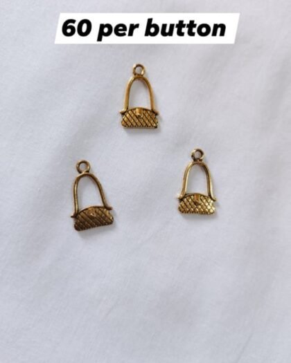 Close-up of Metal Purse Buttons showing purse-shaped design – HnA Boutique Pakistan