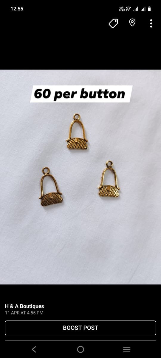 Close-up of Metal Purse Buttons showing purse-shaped design – HnA Boutique Pakistan