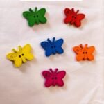 Close-up of colorful multi butterflies wooden buttons – HnA Boutique Pakistan