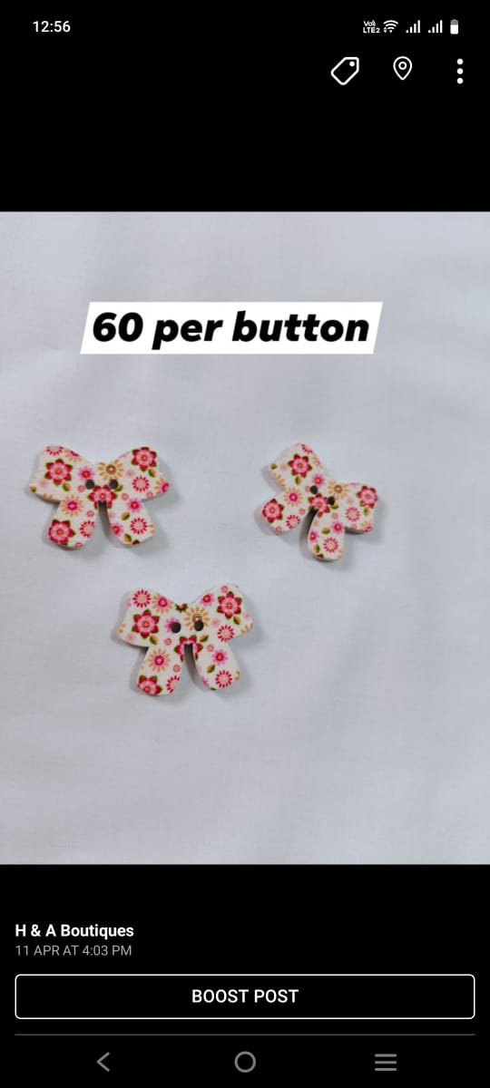 Red & White Bow wooden buttons close-up – vibrant funky accessory by HnA Boutique Pakistan