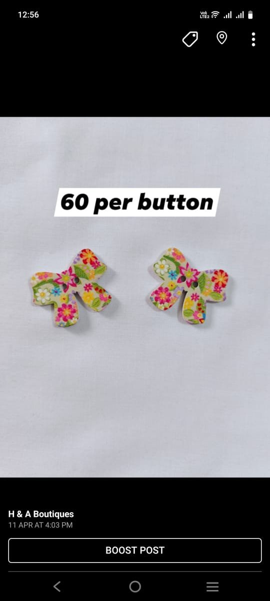 Close-up of Floral Bow wooden buttons with floral design – HnA Boutique Pakistan
