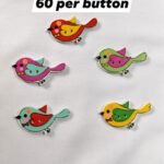 Close-up of Sparrow wooden buttons with bird design – HnA Boutique Pakistan