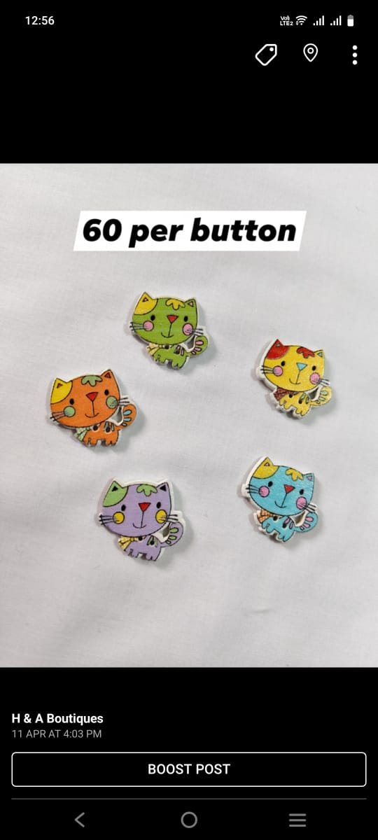 Close-up of Cat wooden buttons with playful cat design – HnA Boutique Pakistan