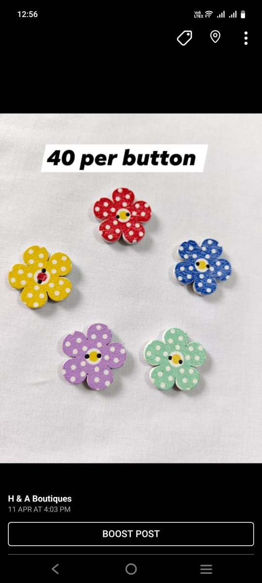 Close-up of Flower Dotted wooden buttons with floral dot design – HnA Boutique Pakistan