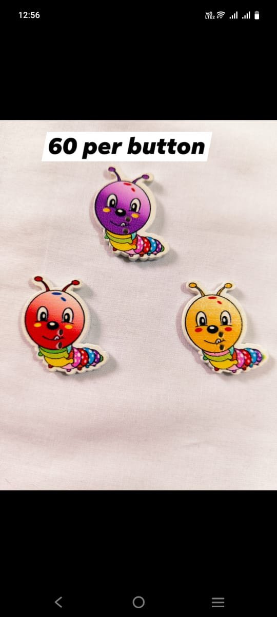 Close-up of Caterpillar 1 wooden buttons with detailed design – HnA Boutique Pakistan