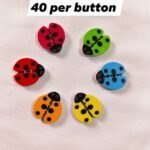Close-up of Multi LadyBug wooden buttons with colorful ladybug design – HnA Boutique Pakistan