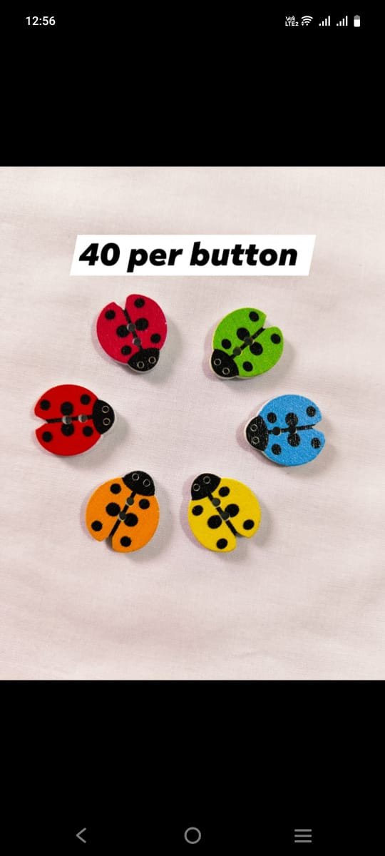 Close-up of Multi LadyBug wooden buttons with colorful ladybug design – HnA Boutique Pakistan