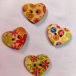 Close-up of Vintage Heart wooden buttons with intricate heart design – HnA Boutique Pakistan