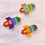 Front view of Rocket Wooden Button with colorful rocket design – HnA Boutique Pakistan