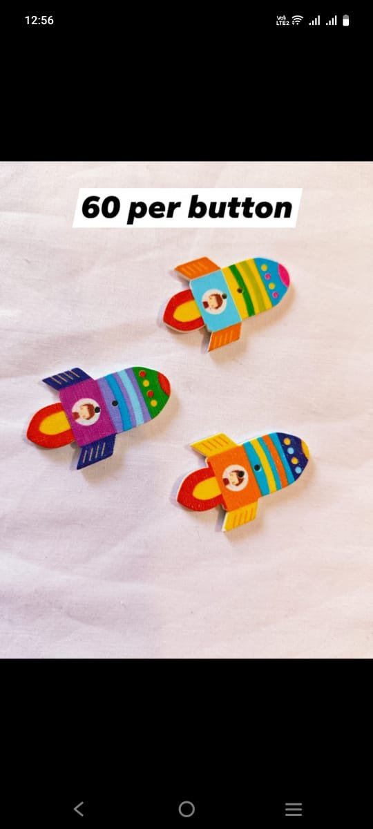 Front view of Rocket Wooden Button with colorful rocket design – HnA Boutique Pakistan