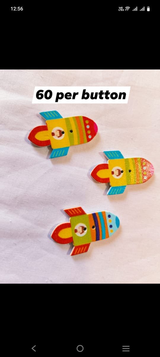 Front view of Rocket 1 Wooden Button with vibrant rocket design – HnA Boutique Pakistan