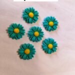 Close-up of Aqua Sunflower Buttons showing detailed floral design – HnA Boutique Pakistan