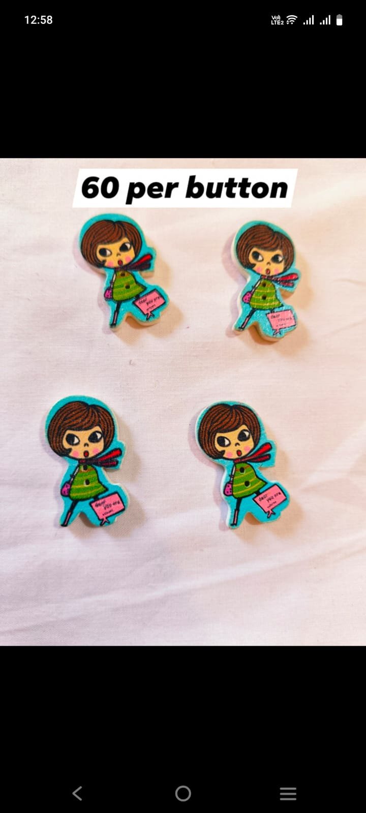 Front view of Aqua Doll Buttons in playful design – HnA Boutique Pakistan