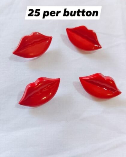 Close-up of red and pink lips-shaped buttons – funky fashion embellishments by HnA Boutique Pakistan