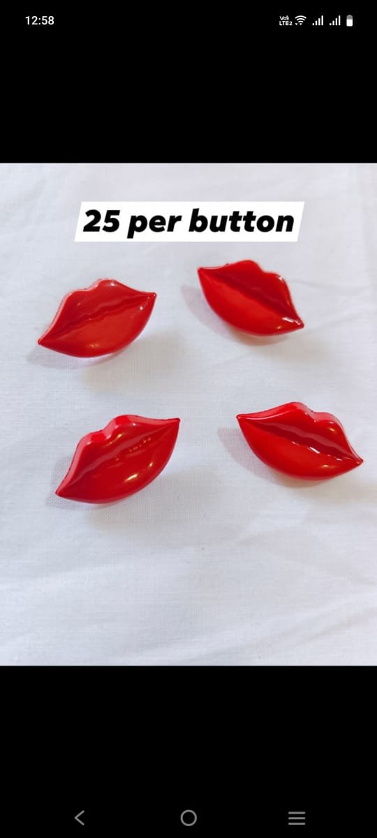 Close-up of red and pink lips-shaped buttons – funky fashion embellishments by HnA Boutique Pakistan