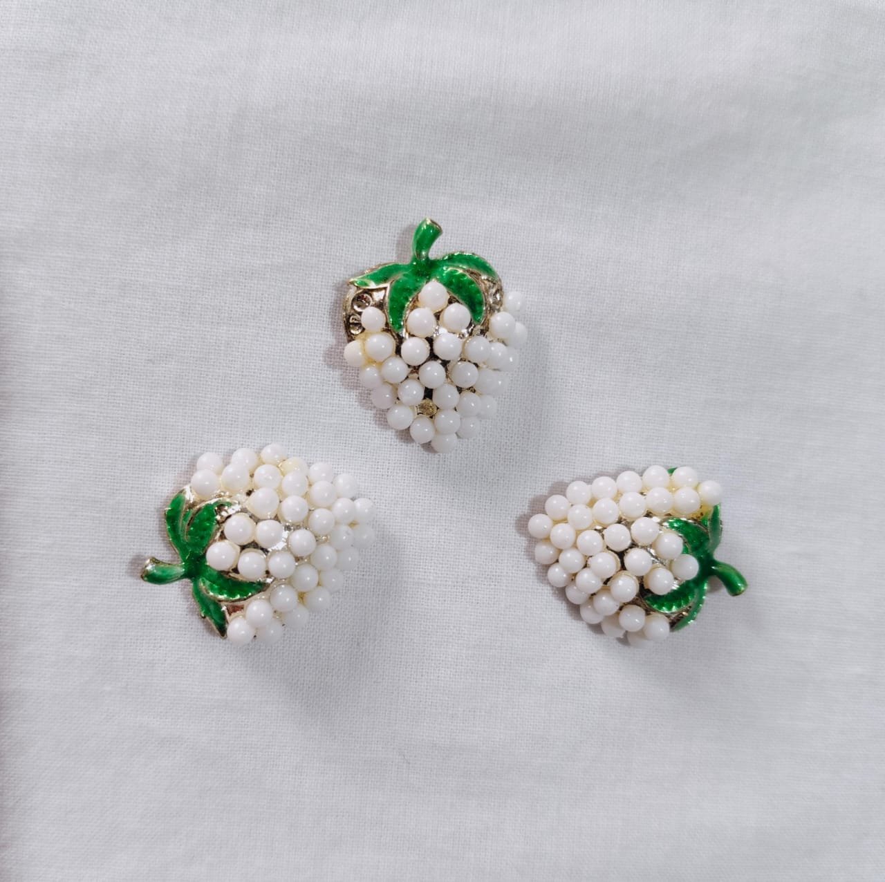 Front view of White Metal Strawberry Button with cute fruit design – HnA Boutique Pakistan