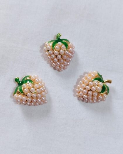 Close-up of Off White Metal Strawberry Button with fruit design – HnA Boutique Pakistan