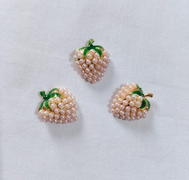 Close-up of Off White Metal Strawberry Button with fruit design – HnA Boutique Pakistan