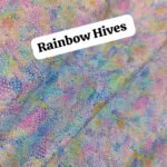 Pastel rainbow honeycomb printed lawn fabric in soft hues of blue, pink, yellow, and purple – 45” width